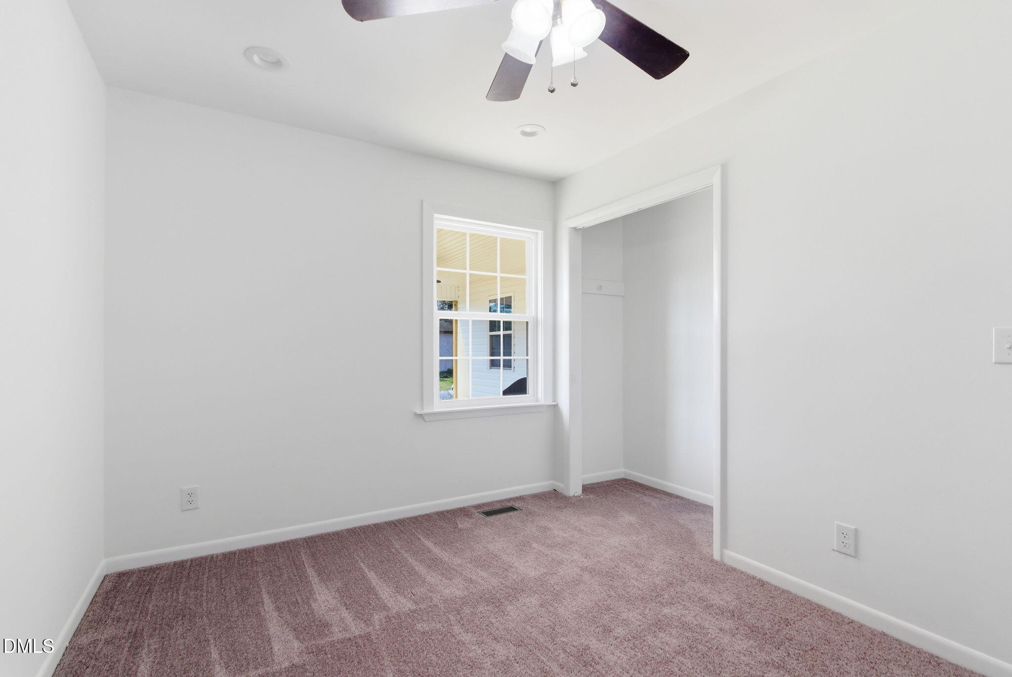 945 Old School Road Four Oaks, NC 27524 - Photo 24 of 37 an empty room with a window