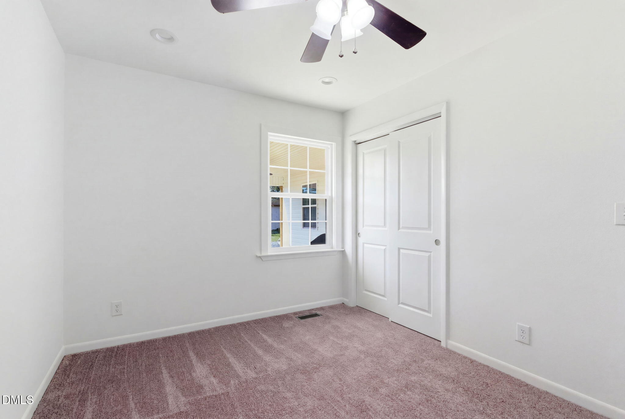 945 Old School Road Four Oaks, NC 27524 - Photo 25 of 37 an empty room with windows
