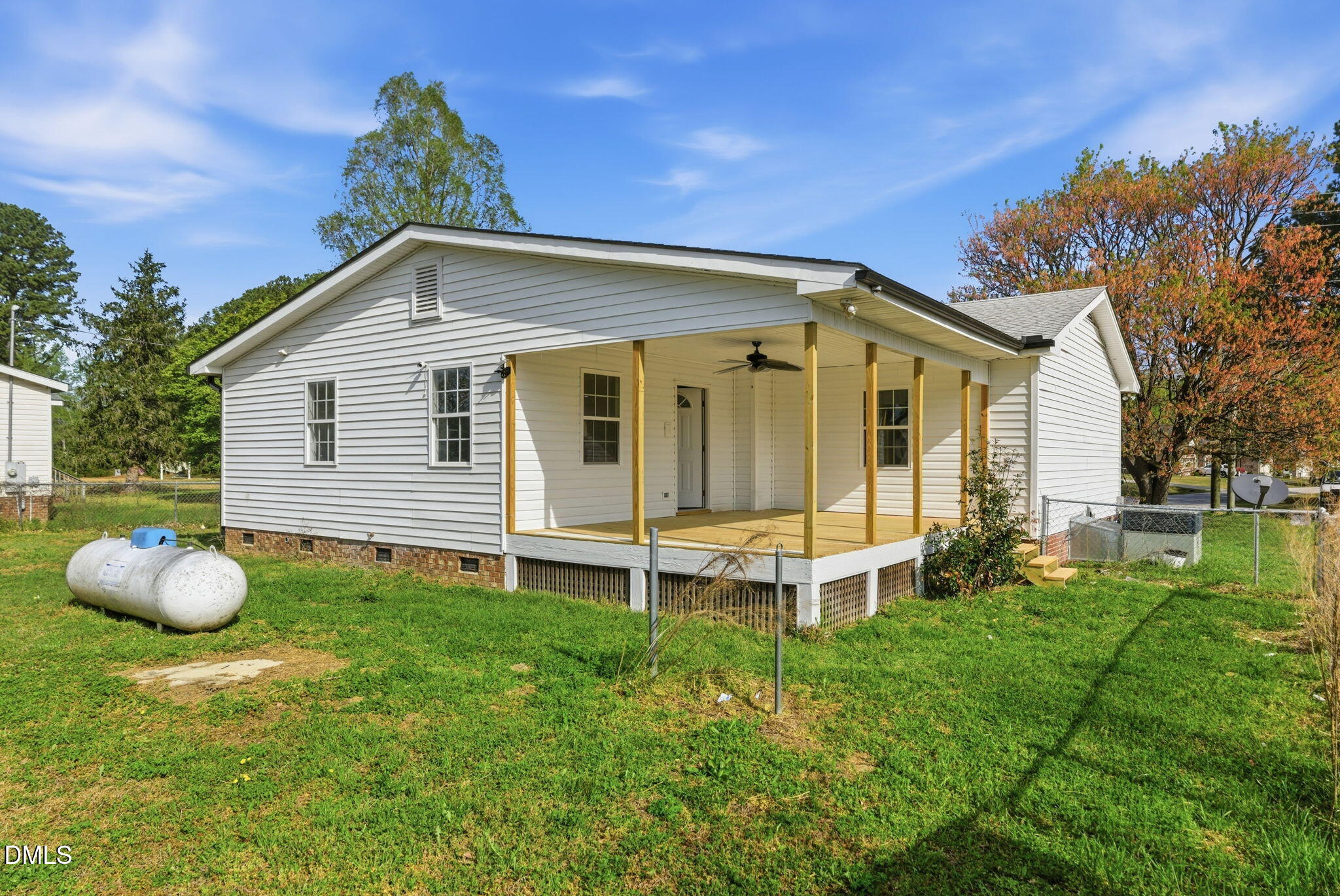 945 Old School Road Four Oaks, NC 27524 - Photo 30 of 37 a backyard of a house with table and chairs