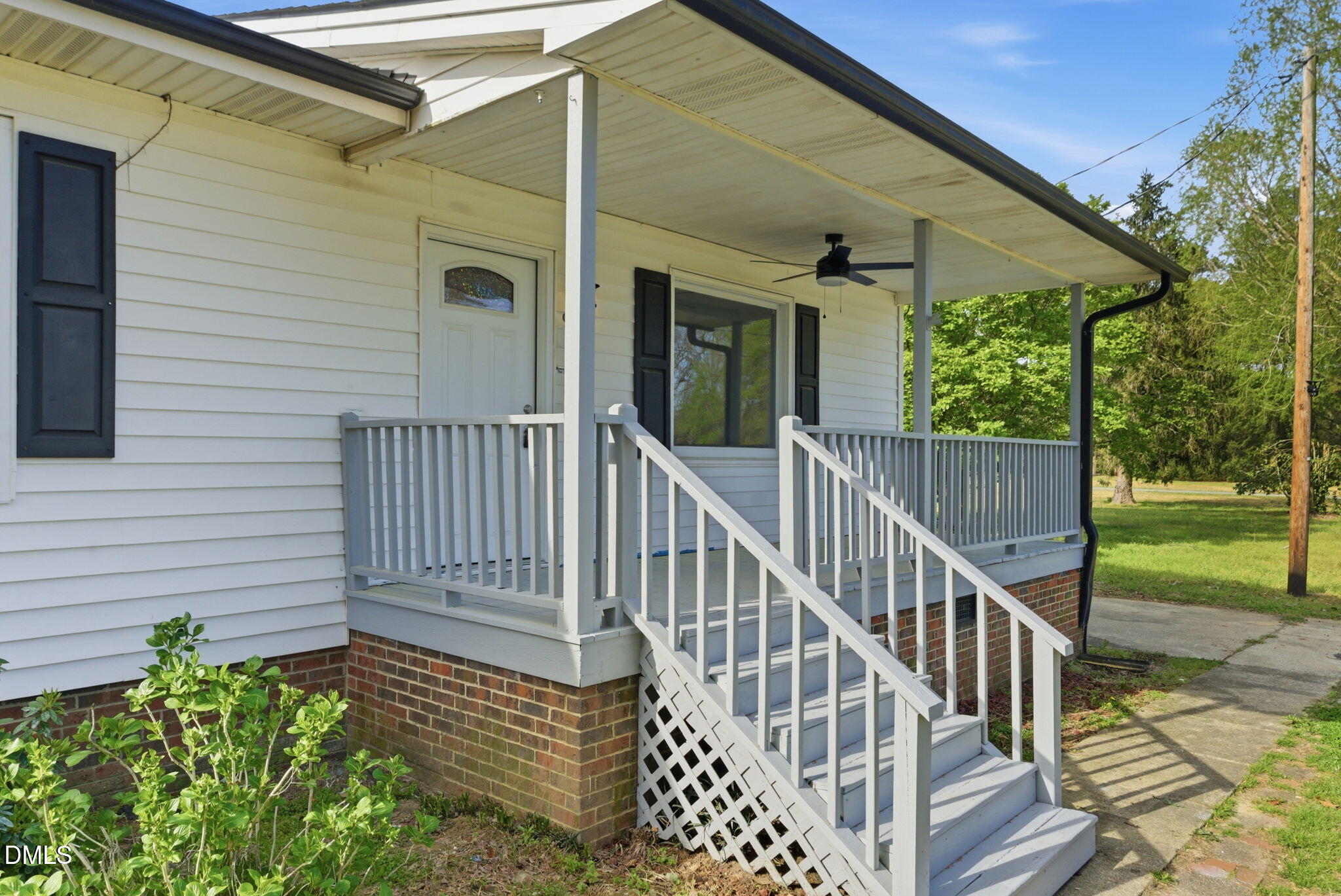 945 Old School Road Four Oaks, NC 27524 - Photo 3 of 37 a view of a chair and table in the patio