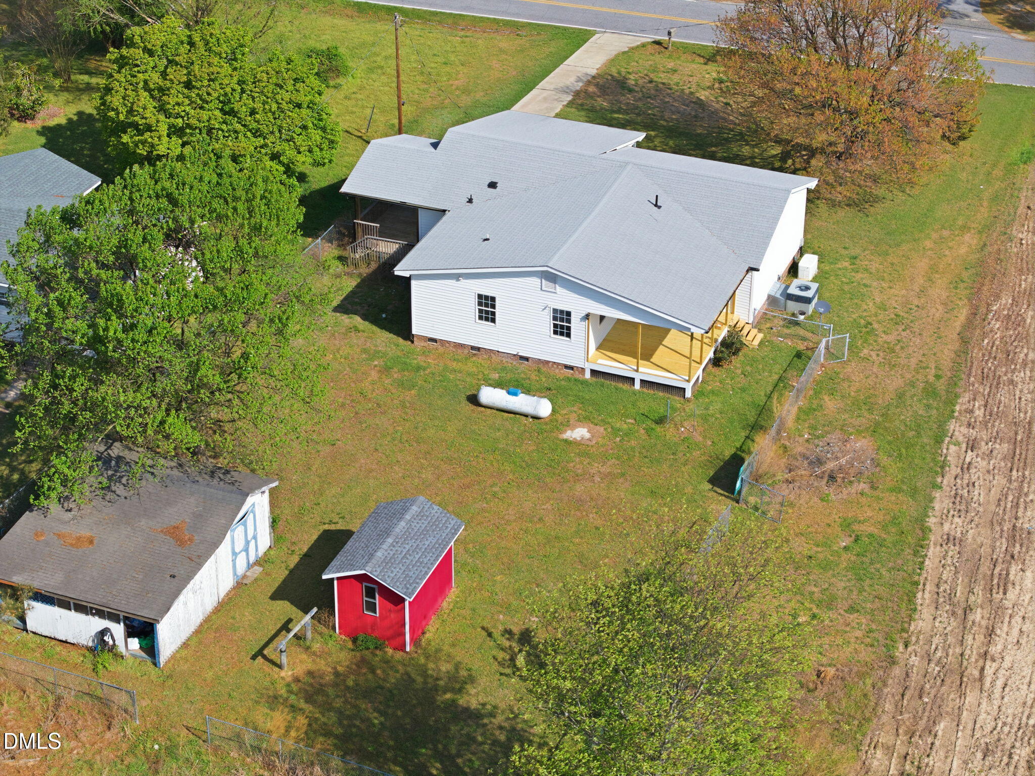 945 Old School Road Four Oaks, NC 27524 - Photo 4 of 37 an aerial view of a house with a yard