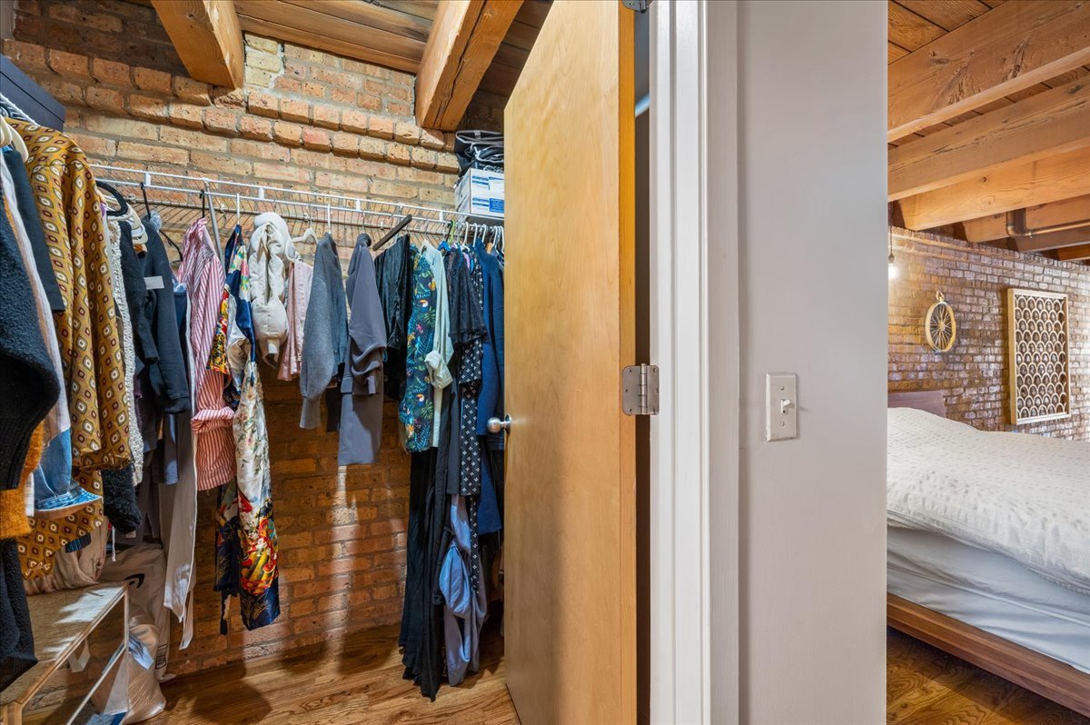 2161 North California Avenue, Unit 105 Chicago, IL 60647 - Photo 19 of 27 a view of walk in closet with clothes