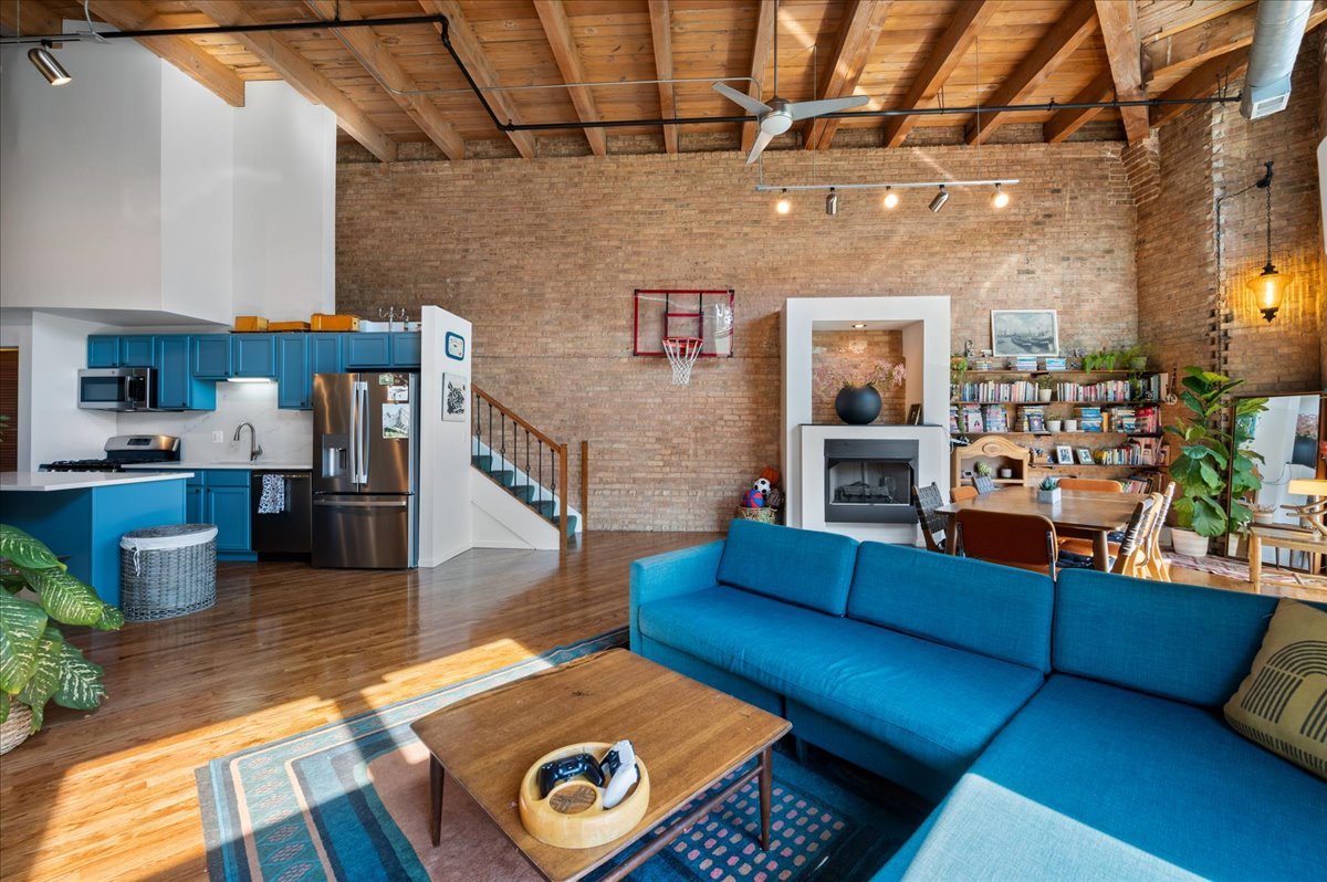 2161 North California Avenue, Unit 105 Chicago, IL 60647 - Photo 5 of 27 a living room with furniture and a fireplace