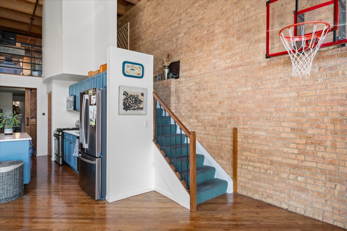 2161 North California Avenue, Unit 105 Chicago, IL 60647 - Photo 9 of 27 a view of an entryway with wooden floor
