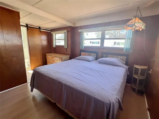 a dining room with a wooden table and chairs