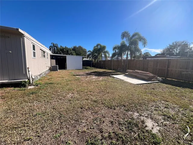 a spacious bedroom with a bed and window