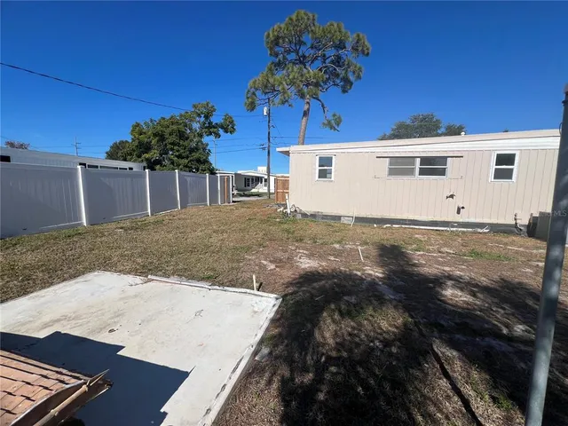 a white toilet sitting next to a small bathroom