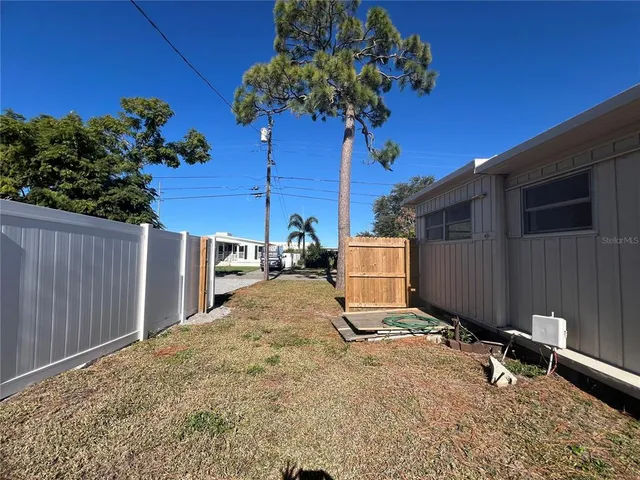 a view of walk in closet with clothes