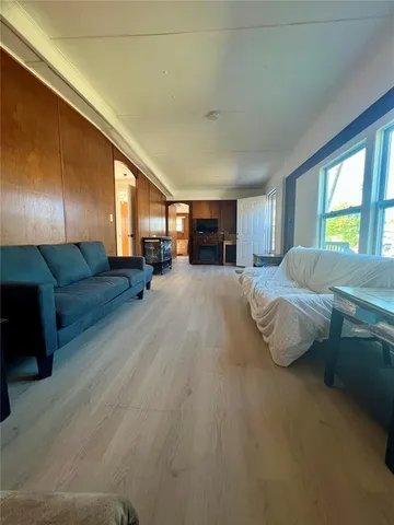 a bathroom with a granite countertop toilet sink and mirror