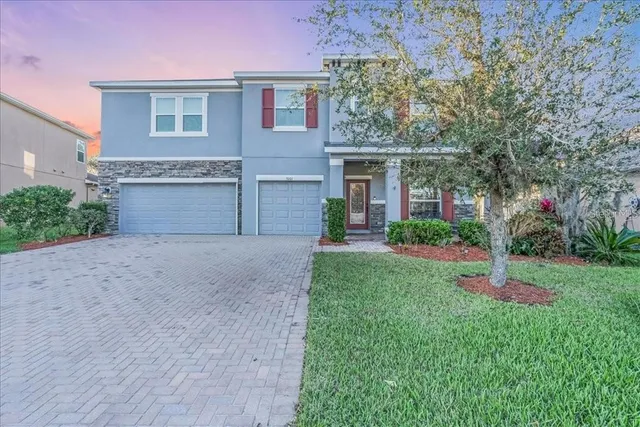 front view of a house with a yard