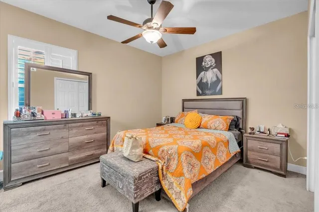 a bedroom with a bed and a dresser