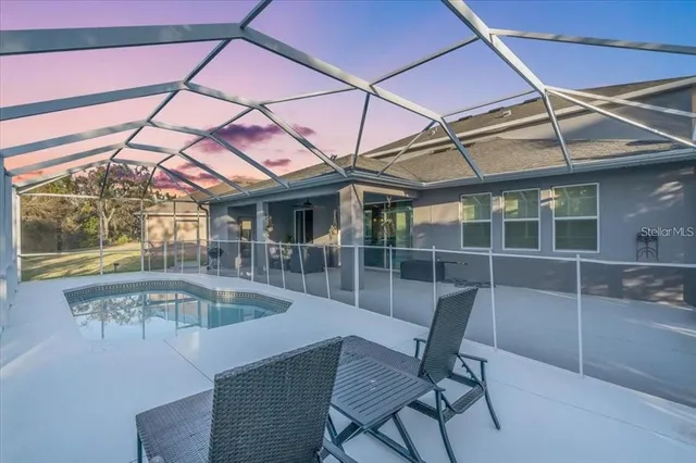 a view of a dining room with furniture wooden floor and a potted plant
