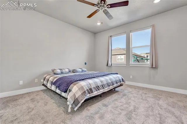 a spacious bedroom with a large bed and a window