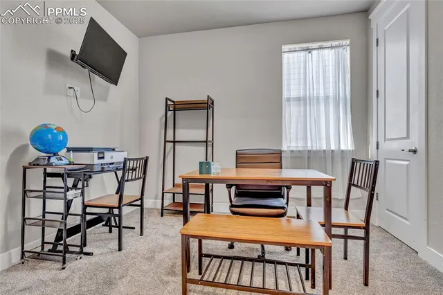 a spacious bedroom with a bed and a window