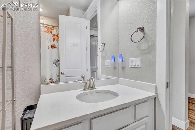 a bathroom with a sink double vanity and a mirror