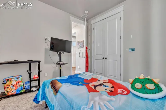 a bedroom with a bed and a mirror