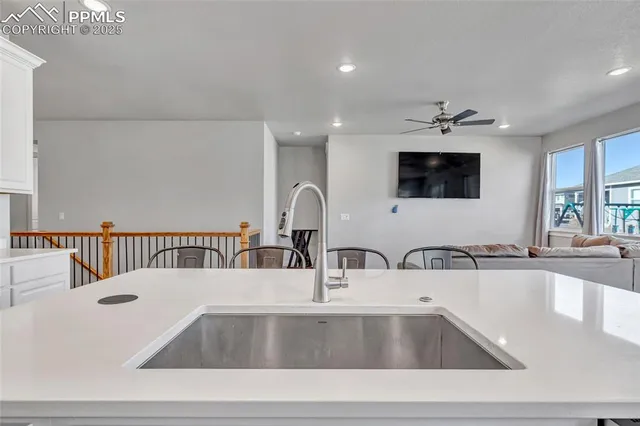 a kitchen with a sink and a microwave