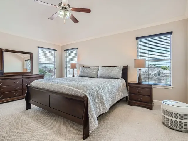 a bedroom with a bed and a cabinets