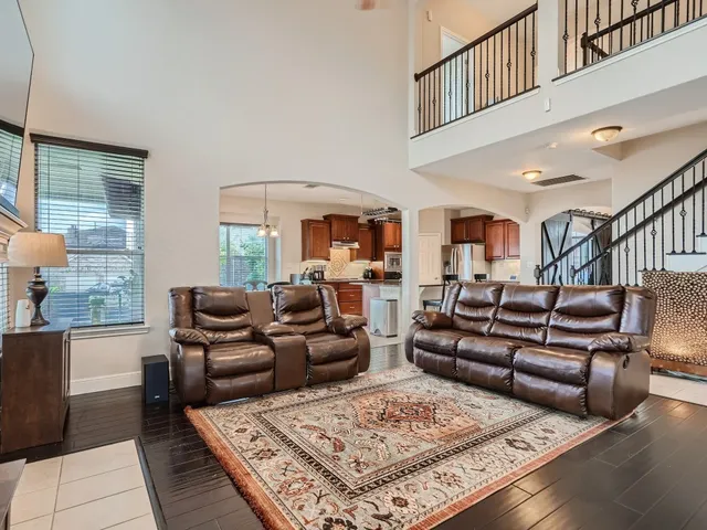 a living room with furniture fireplace and a table