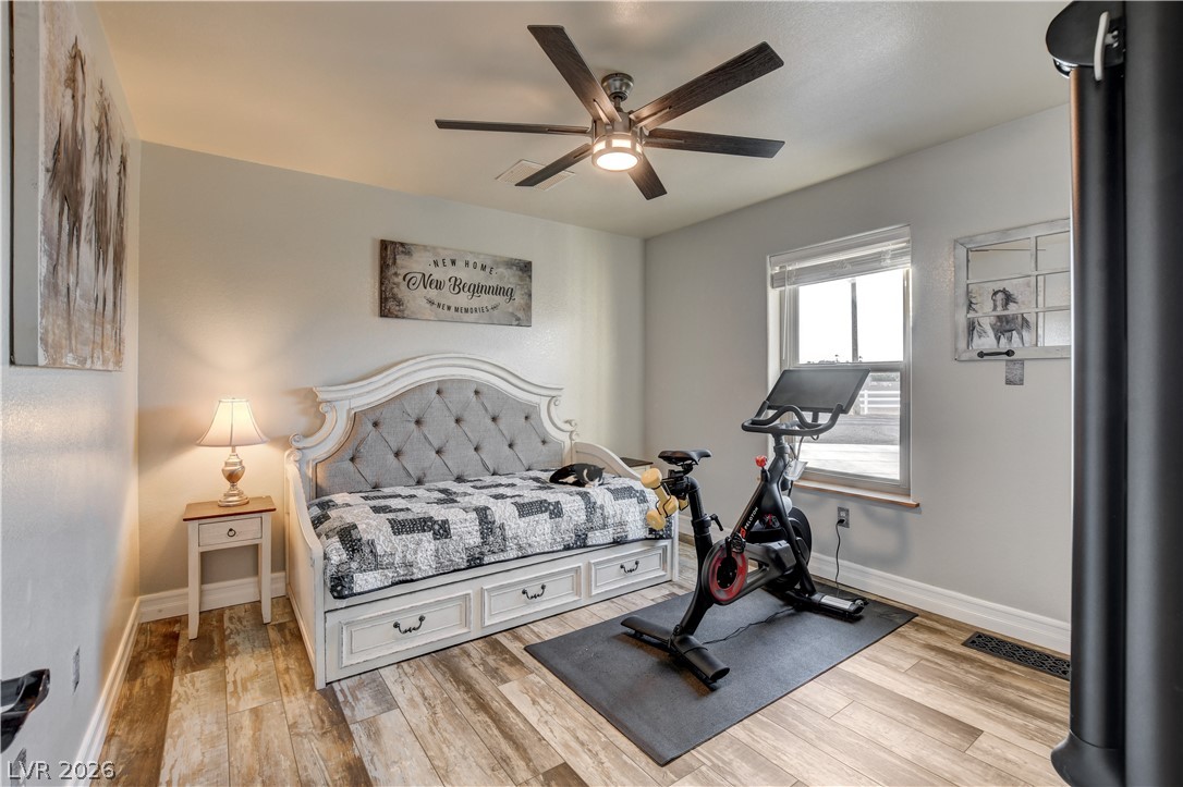 6460 Racel Street Las Vegas, NV 89131 - Photo 53 of 59 Warm wood-look flooring and a classic window define this comfortable multi-use space.
