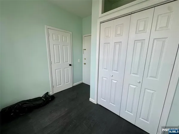 a view of a livingroom with wooden floor