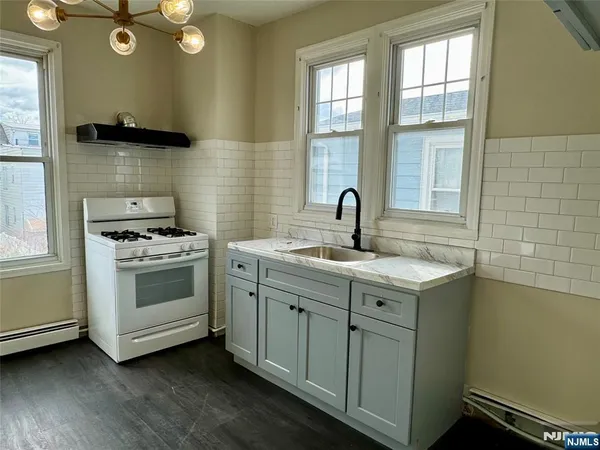 a kitchen with a stove and a sink