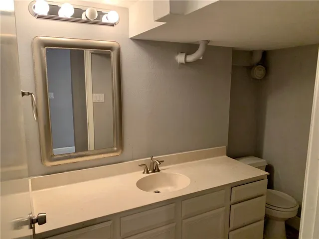 a bathroom with a sink and a vanity