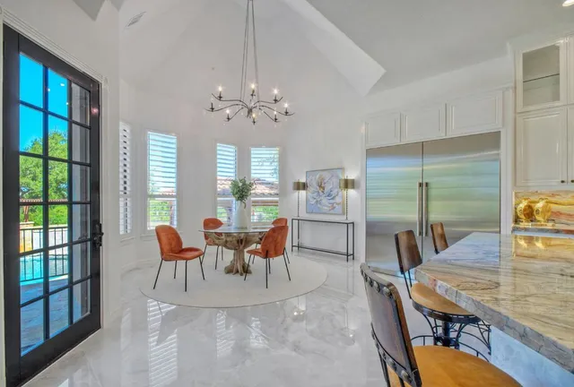 a view of a dining room with furniture window and outside view