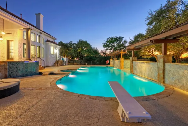 a view of a swimming pool with a patio