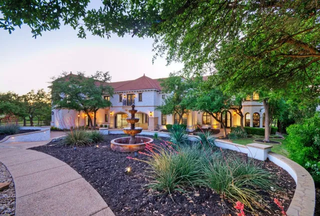 an aerial view of a house with a yard basket ball court and outdoor seating