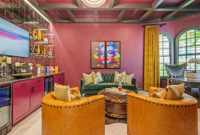 a living room with furniture and a floor to ceiling window