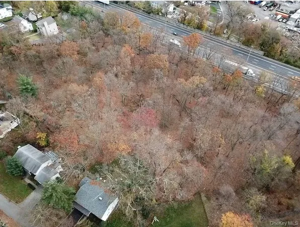 an aerial view of houses with yard