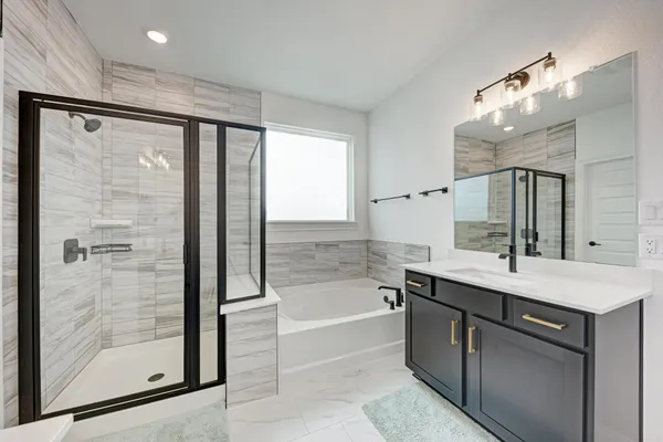 a bedroom with a bed and a ceiling fan