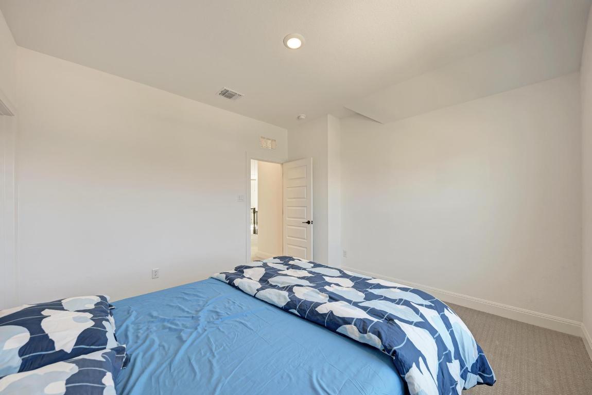 316 Regatta Trail Leander, TX 78641 - Photo 25 of 40 a bedroom with a bed
