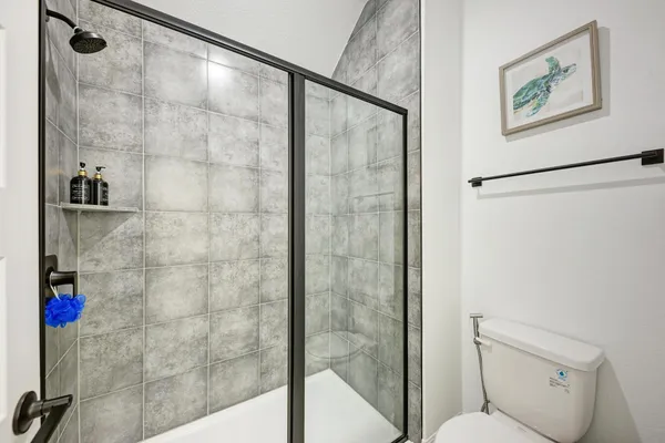 a bathroom with a double vanity sink a mirror and shower