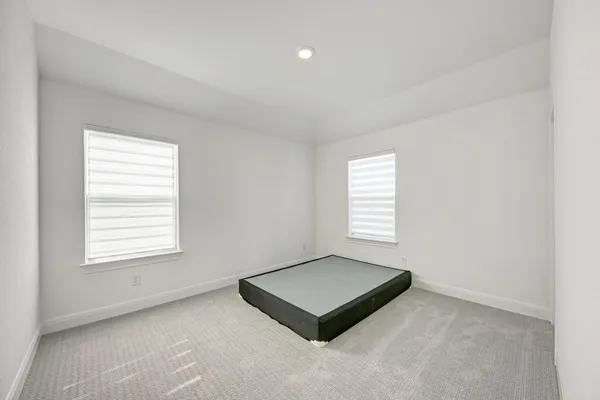 a bathroom with a shower and toilet