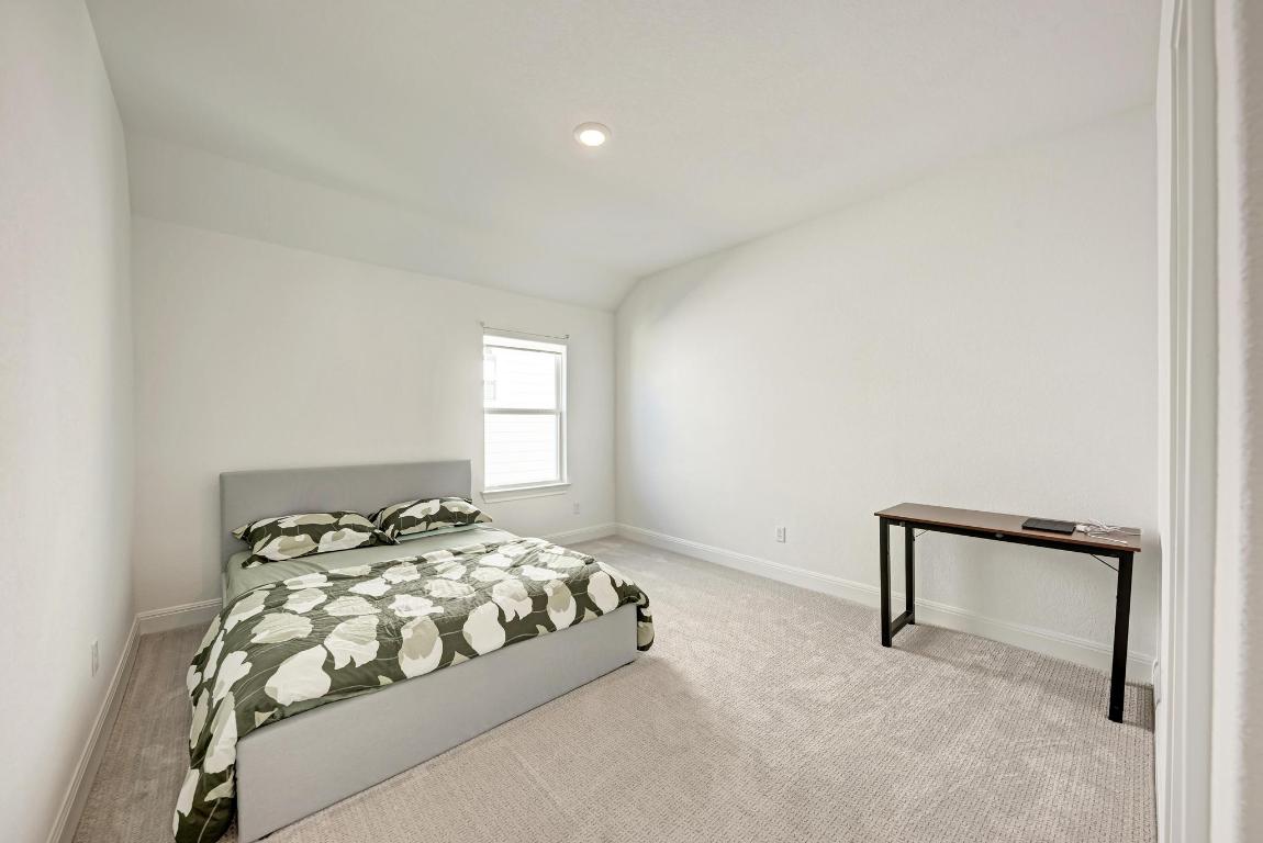 316 Regatta Trail Leander, TX 78641 - Photo 30 of 40 a bedroom with a bed and a window