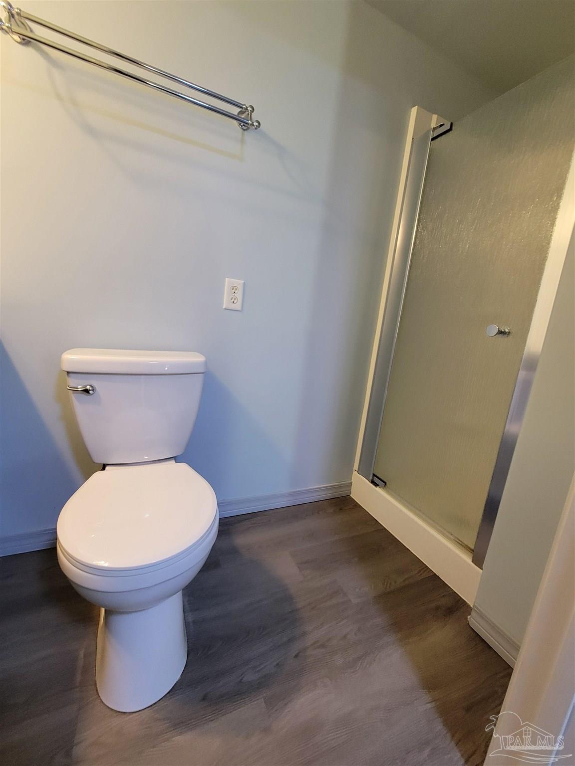 3217 Wallace Lake Road Pace, FL 32571 - Photo 14 of 17 a bathroom with a sink and a toilet