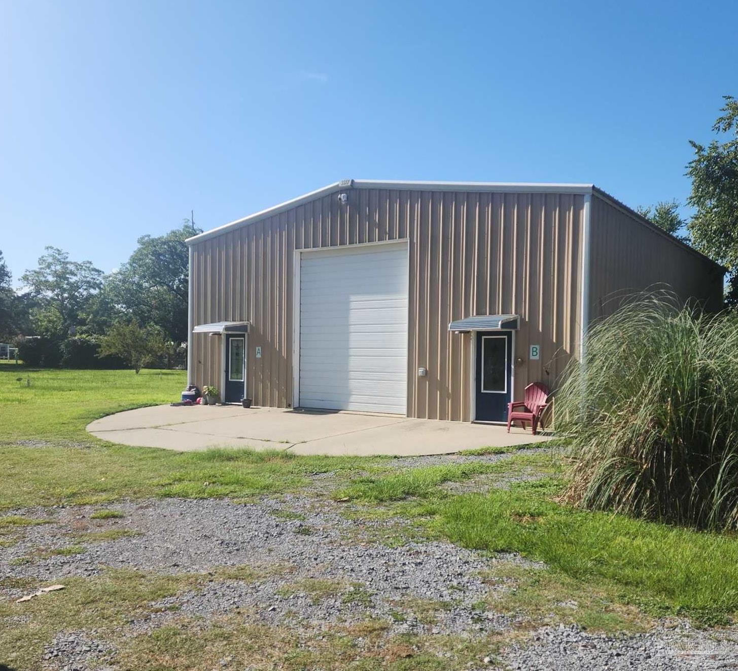 3217 Wallace Lake Road Pace, FL 32571 - Photo 2 of 17 a front view of house with yard and green space