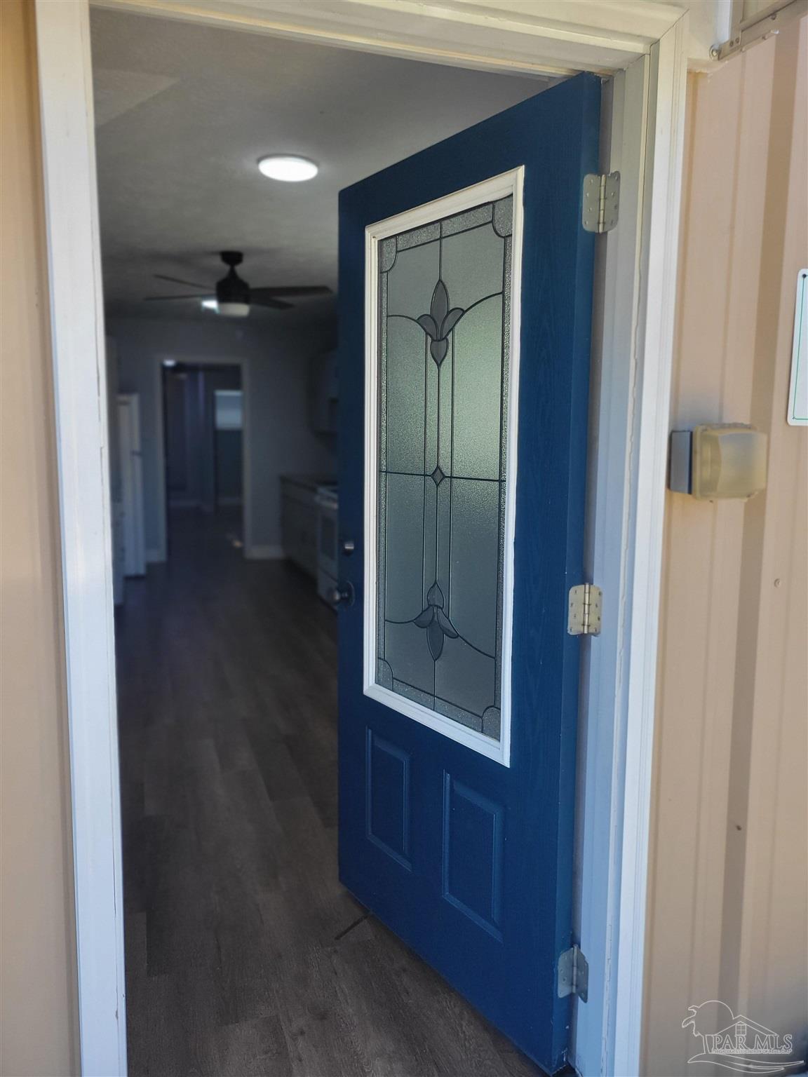 3217 Wallace Lake Road Pace, FL 32571 - Photo 6 of 17 a view of hallway with a hallway and wooden floor