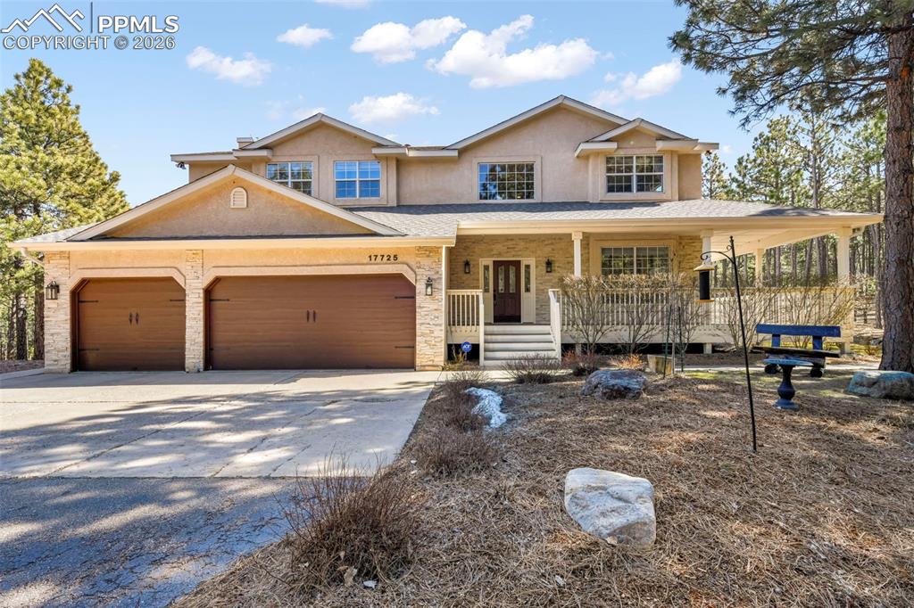 17725 Martingale Road Monument, CO 80132 - Photo 1 of 50 a front view of a house with a yard and garage