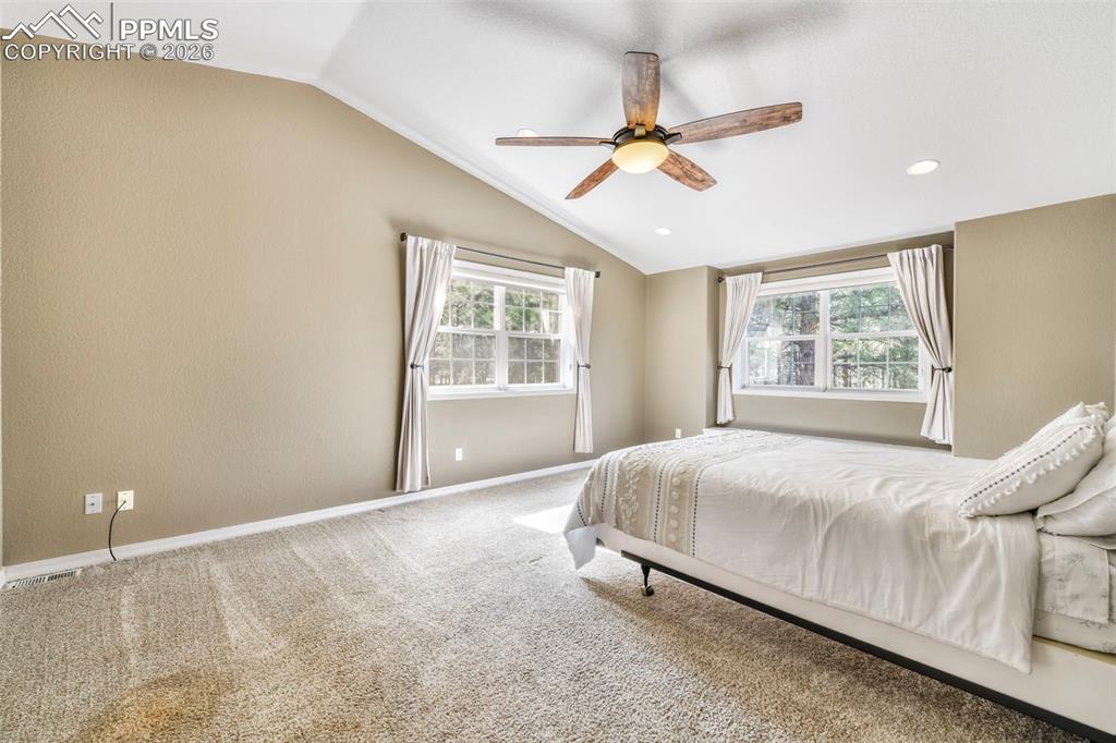 17725 Martingale Road Monument, CO 80132 - Photo 17 of 50 a bedroom with a bed and window