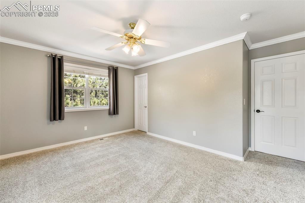 17725 Martingale Road Monument, CO 80132 - Photo 25 of 50 a view of an empty room with window and wooden floor