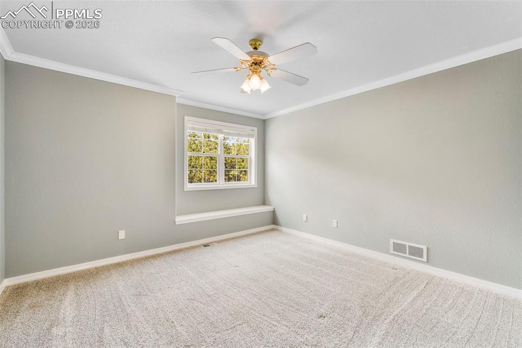 17725 Martingale Road Monument, CO 80132 - Photo 26 of 50 a view of an empty room with a window