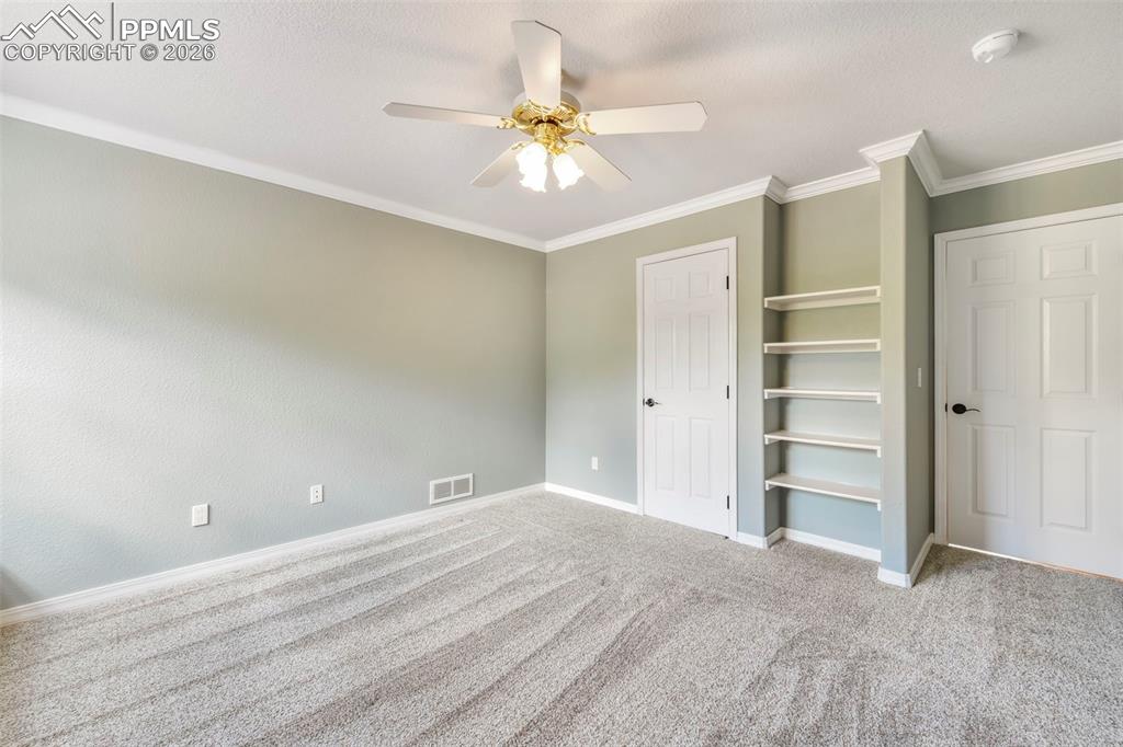 17725 Martingale Road Monument, CO 80132 - Photo 27 of 50 a view of a livingroom with a ceiling fan and entryway