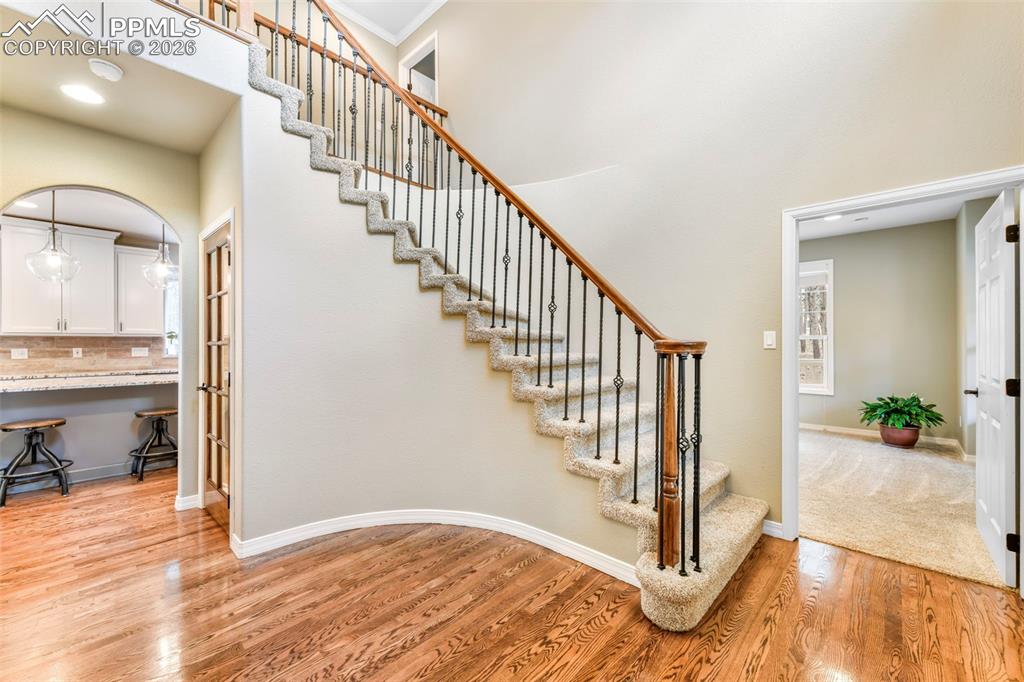 17725 Martingale Road Monument, CO 80132 - Photo 4 of 50 a view of an entryway with wooden floor and a livingroom view