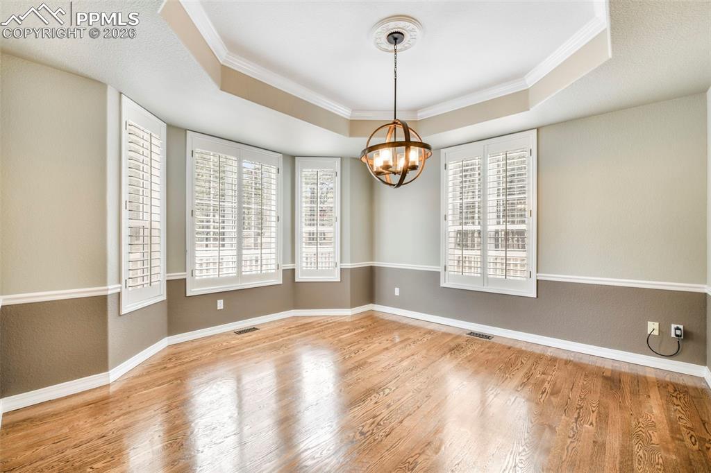 17725 Martingale Road Monument, CO 80132 - Photo 6 of 50 a view of an empty room with window and chandelier