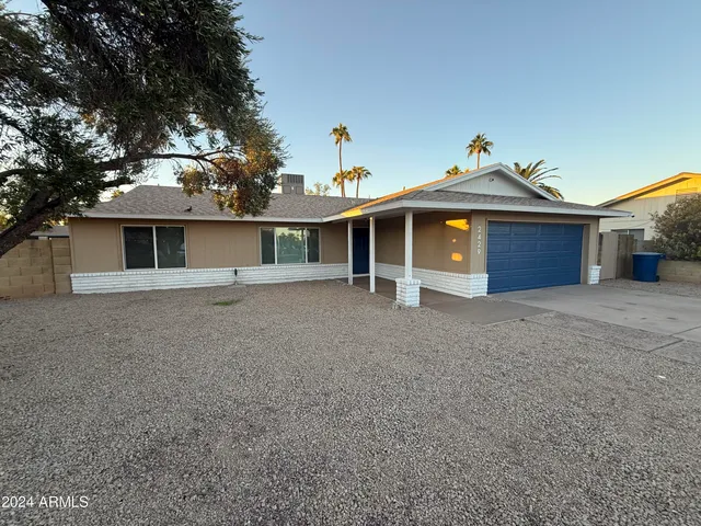 a front view of a house with a garage