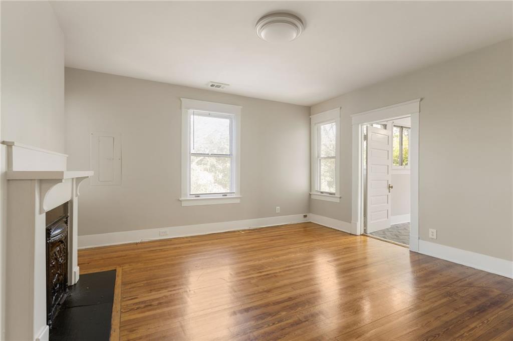 120 South Candler Street Decatur, GA 30030 - Photo 39 of 40 an empty room with wooden floor and a window