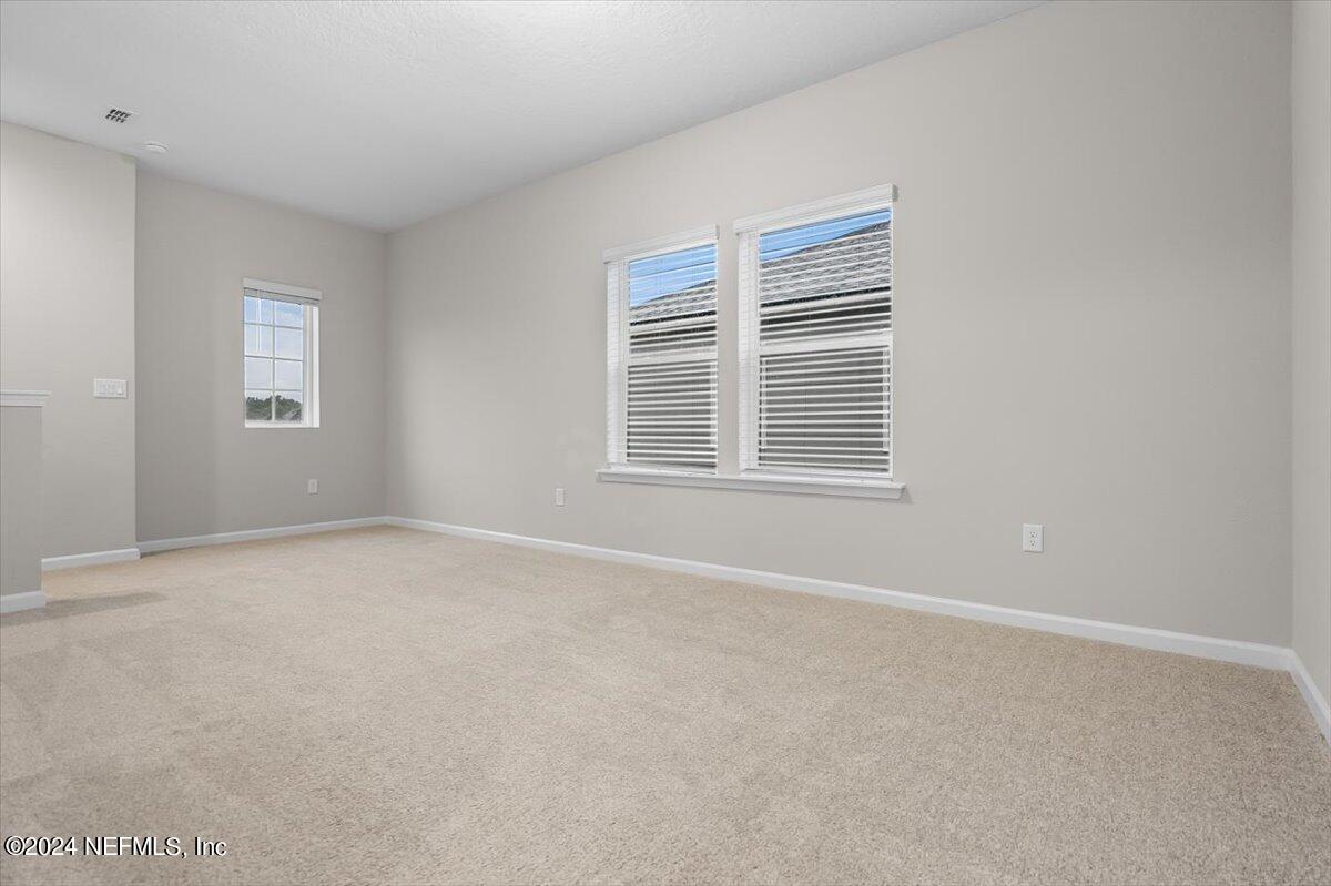 70 Stargaze Lane St. Augustine, FL 32095 - Photo 15 of 41 a view of an empty room with a window